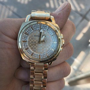 The coach gold watch
